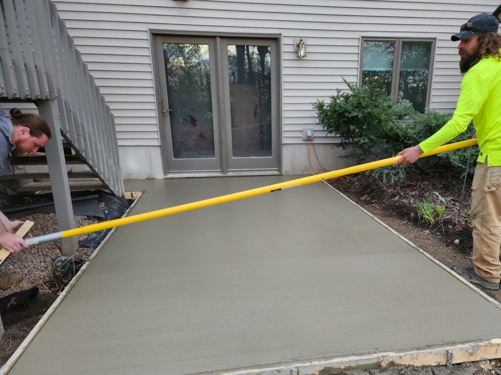 Concrete walkway or sidewalk being installed by a concrete company.