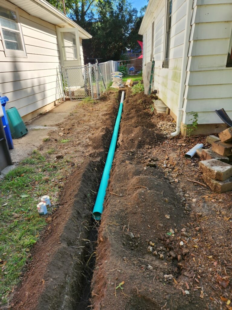 A french drain under construction in Monona, WI built by Oakhaven Contractors in Fall 2023.